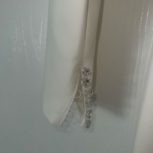 Off the shoulder, fit and flare wedding gown. Chic and vintage sleeve crepe gown